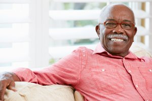 an elderly man smiling