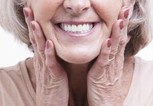 Senior Woman with New Dentures Smiling
